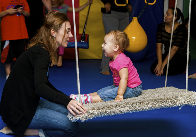 kid and parent carpet swing